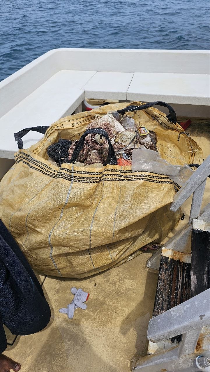 Collected marine waste being transported by boat
