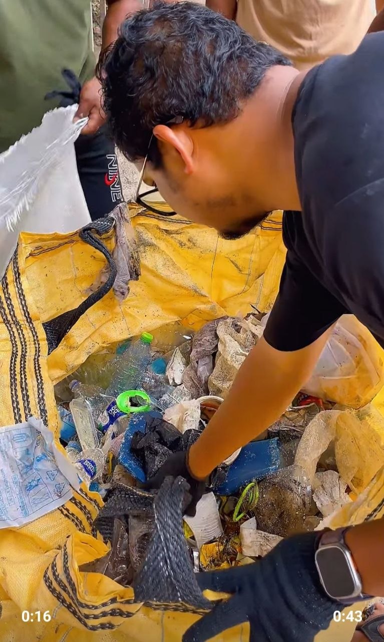 A participant sorting collected waste