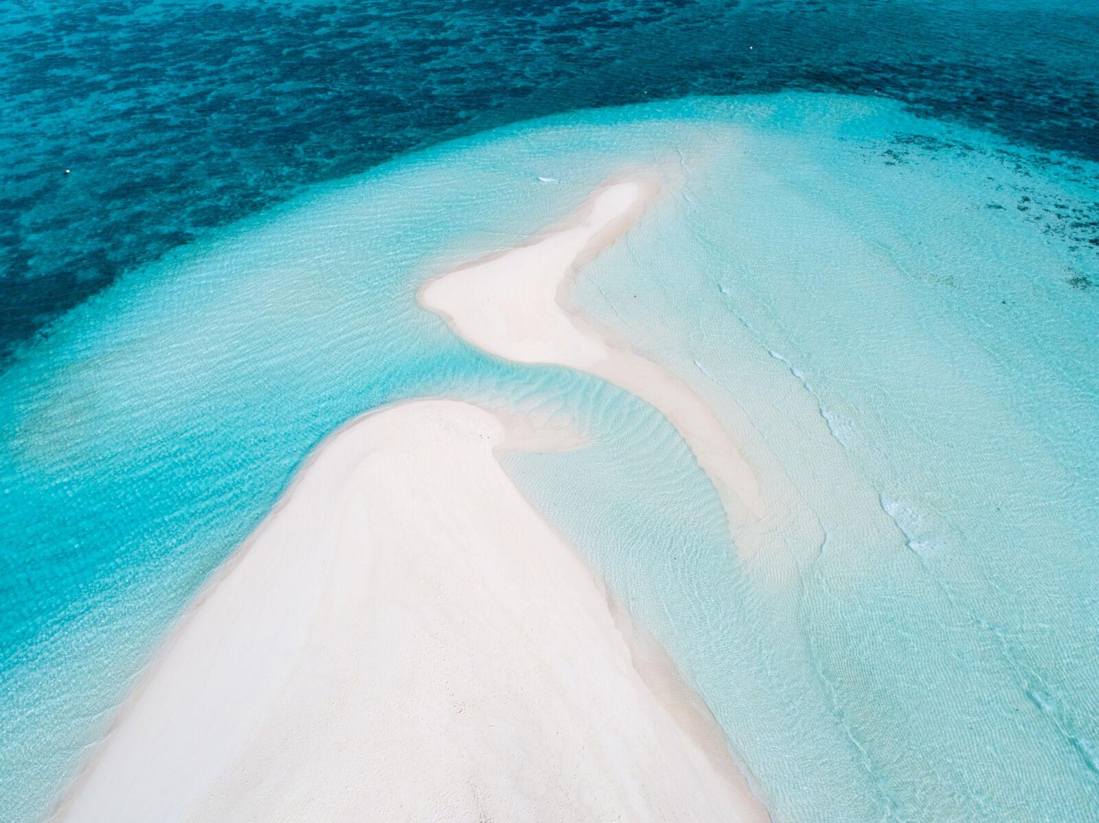 White-sand bank near Dharavandhoo surrounded by clear lagoon water